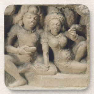 Stone carving of lovers enjoying a dance performan coaster