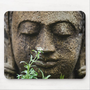 Stone garden statue with flower mouse mat