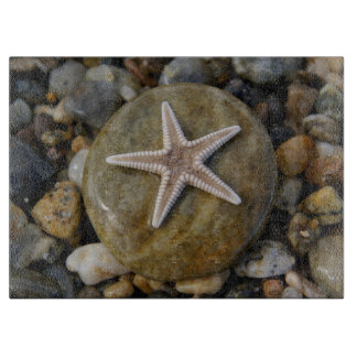 Stone starfish on the beach cutting board