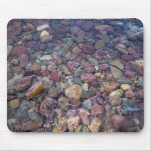 Stones in the lake at Glacier National Park Mouse Mat
