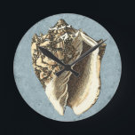 Stonewashed Conch Shell Round Clock<br><div class="desc">Get this unique stonewashed Conch seashell image on your next product. This amazing,  blue background with a tan Conch will look great on anything. Take the beach with you everywhere you go.</div>