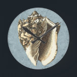 Stonewashed Conch Shell Round Clock<br><div class="desc">Get this unique stonewashed Conch seashell image on your next product. This amazing,  blue background with a tan Conch will look great on anything. Take the beach with you everywhere you go.</div>