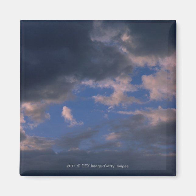 Storm clouds against blue sky magnet (Front)