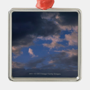 Storm clouds against blue sky metal tree decoration