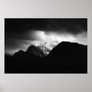 Storm clouds and sun over mountains poster
