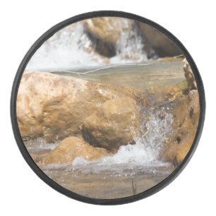 Stormy stream in spring hockey puck