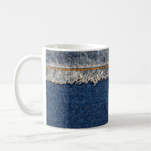 Straight stitch with orange thread on bleached den coffee mug