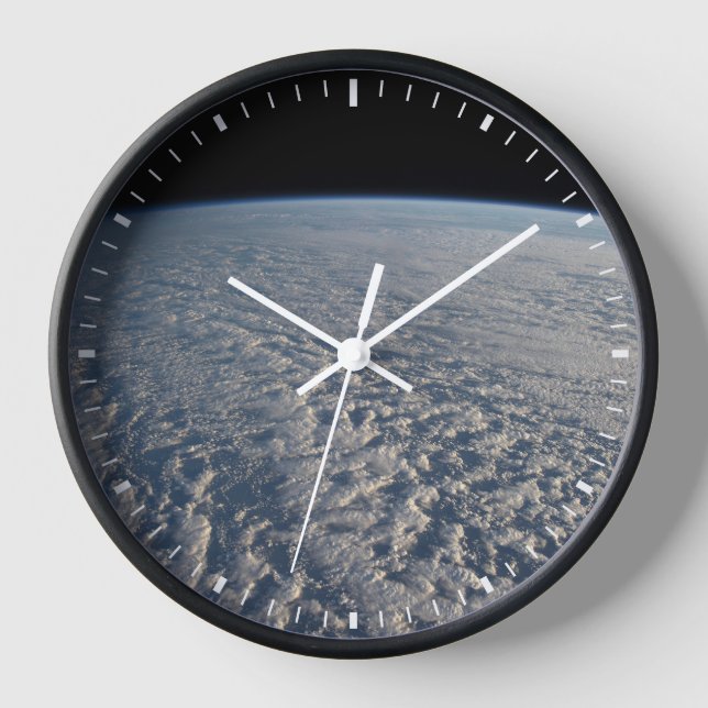 Stratocumulus Clouds Above The Pacific Ocean. Clock (Front)