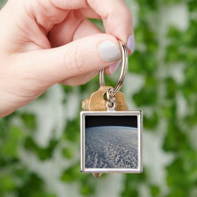 Stratocumulus Clouds Above The Pacific Ocean. Key Ring (Hand)