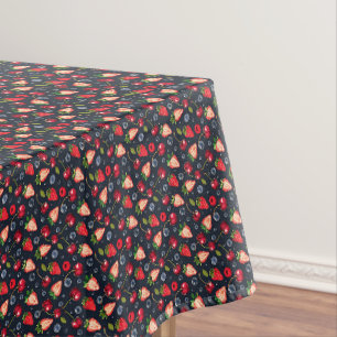 Strawberries and cherries on a dark background tablecloth