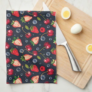Strawberries and cherries on a dark background tea towel