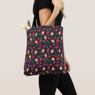Strawberries and cherries on a dark background   tote bag