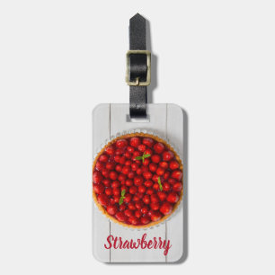 Strawberry cake with mint on white wood luggage tag