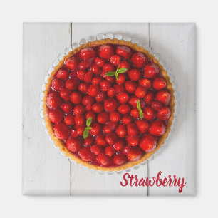 Strawberry cake with mint on white wood magnet