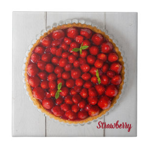 Strawberry cake with mint on white wood tile