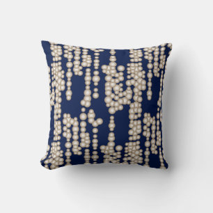 Stream of bubbles, white on navy blue cushion