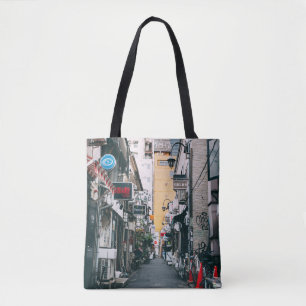STREET BETWEEN GRAY CONCRETE BUILDINGS TOTE BAG