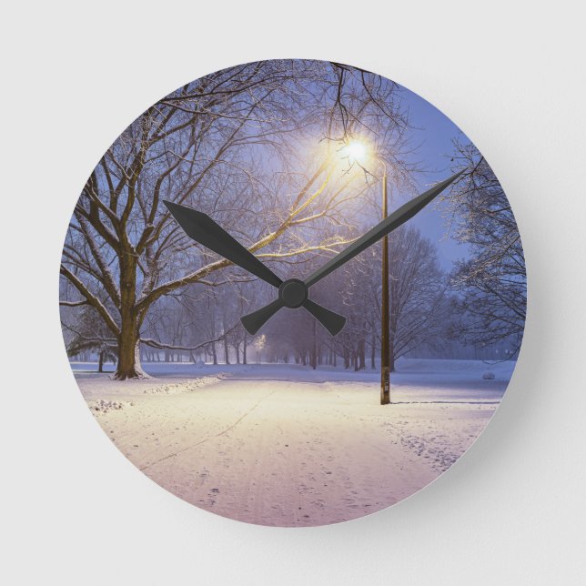 Street lights and covered in snow trees round clock (Front)
