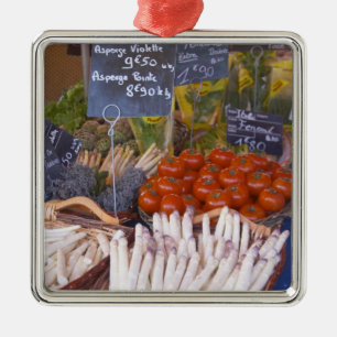 Street market merchant's stall with white metal tree decoration