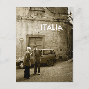 Street scene in sepia postcard with text: 'Italia'