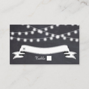String of lights  on chalkboard wedding place card