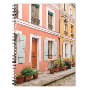 STRUCTURAL PHOTOGRAPHY OF MULTICOLORED BUILDING NOTEBOOK