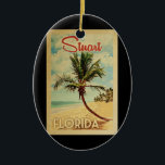 Stuart Palm Tree Vintage Travel Ceramic Tree Decoration<br><div class="desc">A uniquely retro mid-century modern Stuart Florida art print in vintage travel poster style. It features a curved palm tree on sandy beach with ocean under a blue cloudy sky.</div>