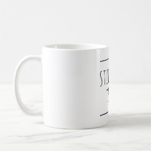 Student tears coffee mug