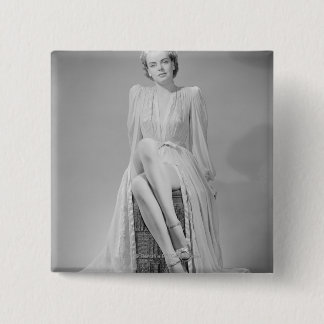 Studio portrait of young woman in nightgown 15 cm square badge