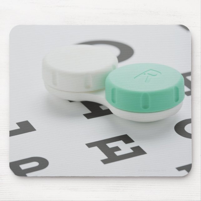 Studio shot of contact lens case on eye chart mouse mat (Front)