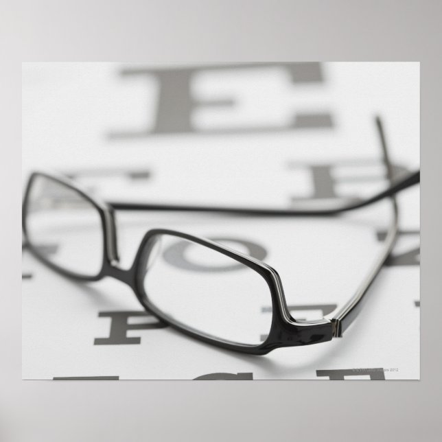 Studio shot of eyeglasses on eye chart (Front)
