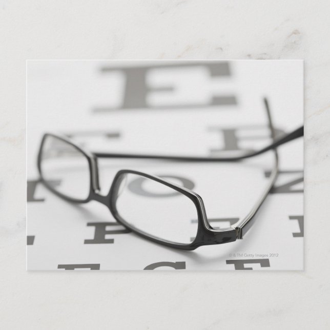 Studio shot of eyeglasses on eye chart postcard (Front)