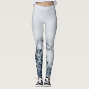 Stunning snowy mountains covered by clouds leggings