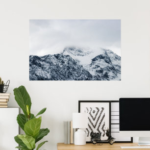 Stunning snowy mountains covered by clouds poster