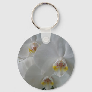 Stunning white orchids on a keychain