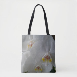 Stunning white orchids on an all over print tote bag