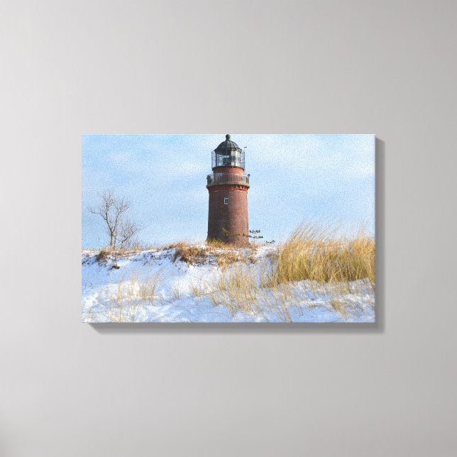 Sturdy Lighthouse on a Rocky Coast in Winter Canvas Print (Front)
