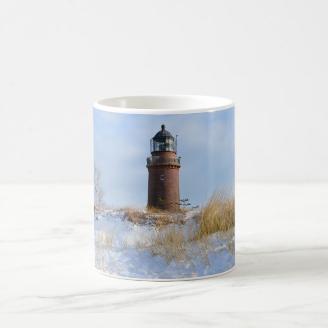 Sturdy Lighthouse on a Rocky Coast in Winter Coffee Mug (Center)