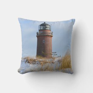 Sturdy Lighthouse on a Rocky Coast in Winter Cushion