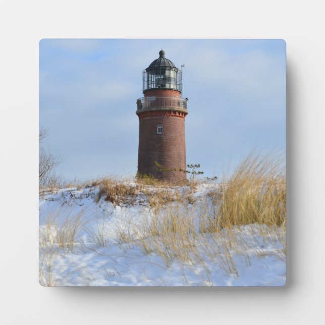 Sturdy Lighthouse on a Rocky Coast in Winter Plaque (Front)