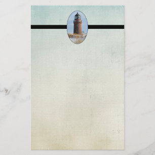 Sturdy Lighthouse on a Rocky Coast in Winter Stationery