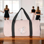 Stylish Unique Monogram Typography Blush Pink Duffle Bag<br><div class="desc">A stylish unique monogram design featuring your name and monogram accents this custom duffel bag with classic serifs and a more ornate script typography in a lovely layout. The three elements blend together beautifully to create your own personal branding logo. Shown here with a soft blush pink background with monogram...</div>