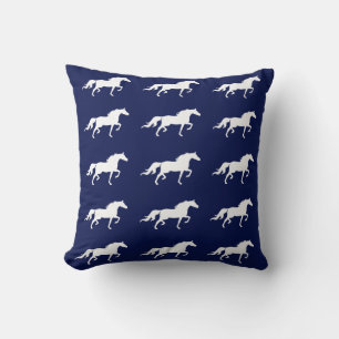 Stylish white horse silhouettes on navy blue cushion
