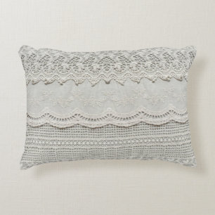 Subtle white lace, textile close-up. decorative cushion