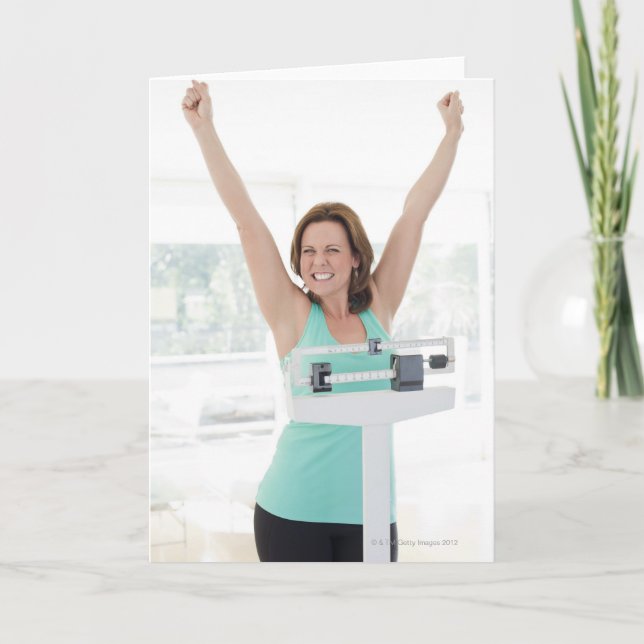 Successful weight loss. Happy woman weighing Card (Front)