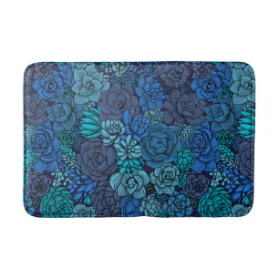Succulent garden in blue bath mat