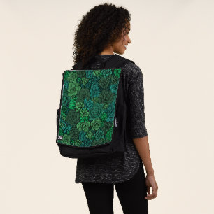 Succulent garden in green backpack