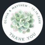 Succulent Wedding Thank You | Watercolor Botanical Classic Round Sticker<br><div class="desc">Complete your celebration with this personalised thank you sticker, featuring a beautiful watercolor succulent design surrounded by your names, wedding date, and a thank you message. Perfect for sealing wedding favours, thank you bags, welcome boxes, or envelopes, this round succulent sticker adds a natural and stylish touch to your event....</div>