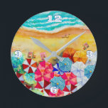 Summer Beach Umbrellas  Round Clock<br><div class="desc">Waves on a sandy beach,  sunbathers under colorful umbrellas,  this clock is a fun addition to your beach house or summer decor or give as a gift. MATCHING items in our store.</div>