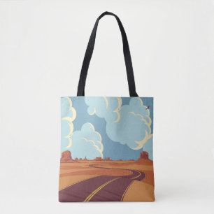 Summer landscape with an empty winding road in the tote bag